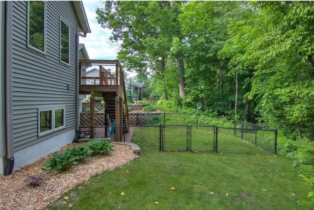 1403 Elm Ave, Menomonie, WI 54751 - view of yard featuring a gate, stairway, and a deck