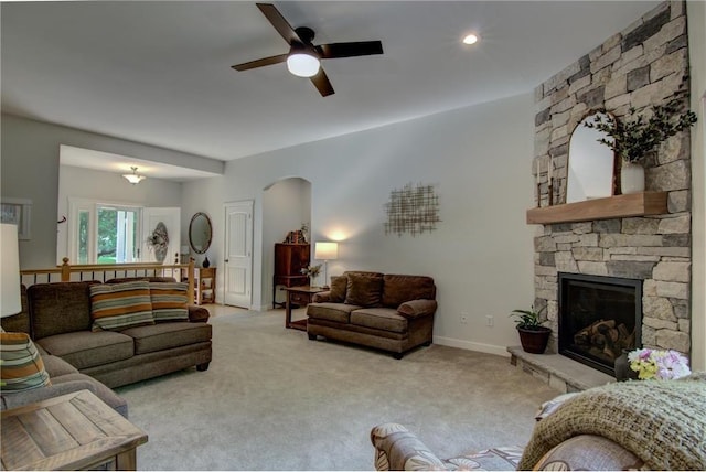 1403 Elm Ave, Menomonie, WI 54751 - living room featuring a ceiling fan, arched walkways, carpet floors, and a fireplace