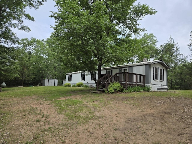 2143 County Road Z, Friendship, WI 53934 - view of green lawn featuring a storage unit and a deck