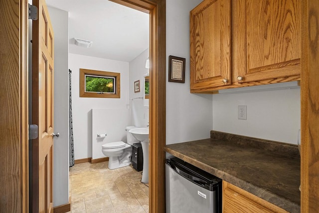 N12757 Rivers Meet Dr, Athelstane, WI 54104 - bathroom with toilet and baseboards