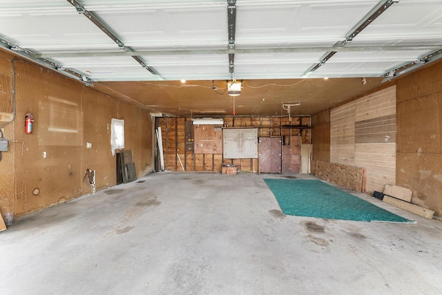 1647 Loomis St, La Crosse, WI 54603 - garage with a garage door opener and wood walls