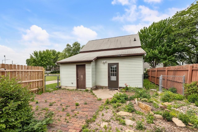 1432 Loomis St, La Crosse, WI 54603 - rear view of property featuring a fenced backyard and a patio area