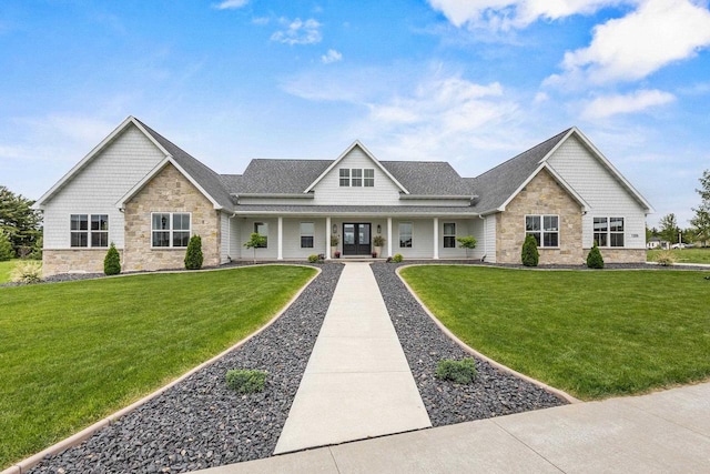 7205 N Trinity Ct, Appleton, WI 54913 - view of front of home featuring stone siding, covered porch, a front yard, and a shingled roof