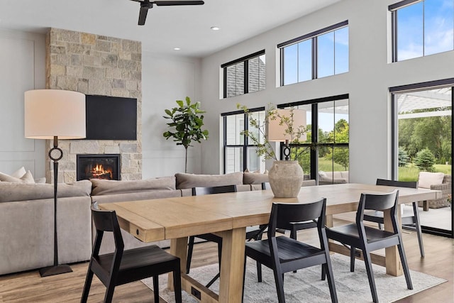 7205 N Trinity Ct, Appleton, WI 54913 - dining space featuring plenty of natural light, a ceiling fan, light wood-style flooring, recessed lighting, and a towering ceiling