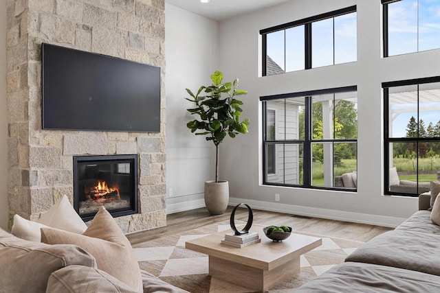 7205 N Trinity Ct, Appleton, WI 54913 - living area featuring healthy amount of natural light, a fireplace, wood finished floors, and recessed lighting
