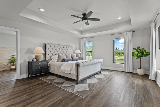 7205 N Trinity Ct, Appleton, WI 54913 - bedroom with a tray ceiling, dark wood-type flooring, recessed lighting, and ceiling fan