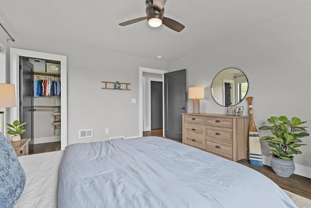 7205 N Trinity Ct, Appleton, WI 54913 - bedroom with wood finished floors, a ceiling fan, and a spacious closet