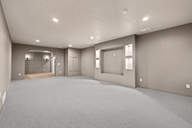 7205 N Trinity Ct, Appleton, WI 54913 - empty room featuring arched walkways, light carpet, a smoke detector, and recessed lighting