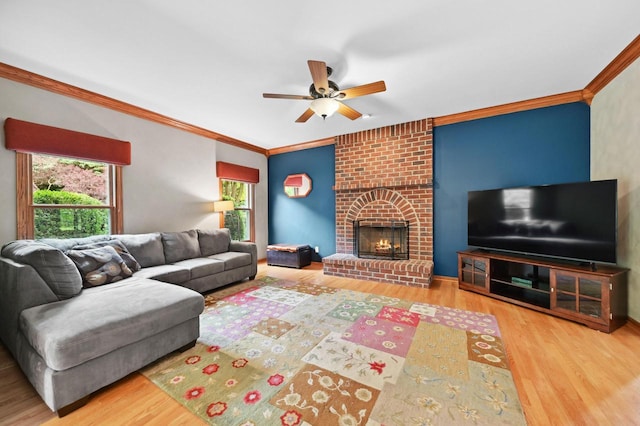 20750 Chadwick Ln, Brookfield, WI 53045 - living area featuring wood finished floors, a ceiling fan, crown molding, and a brick fireplace