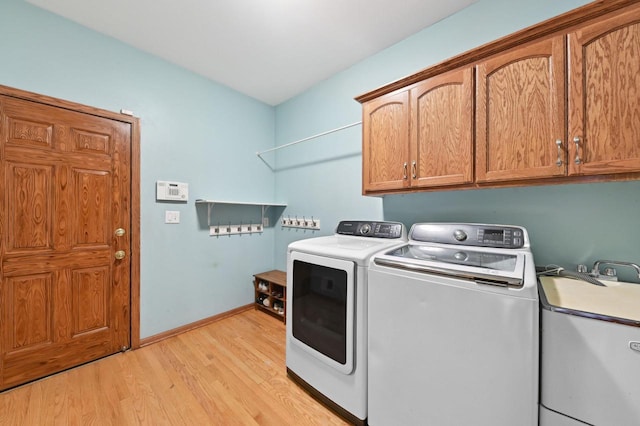 20750 Chadwick Ln, Brookfield, WI 53045 - laundry room with cabinet space, independent washer and dryer, and light wood finished floors