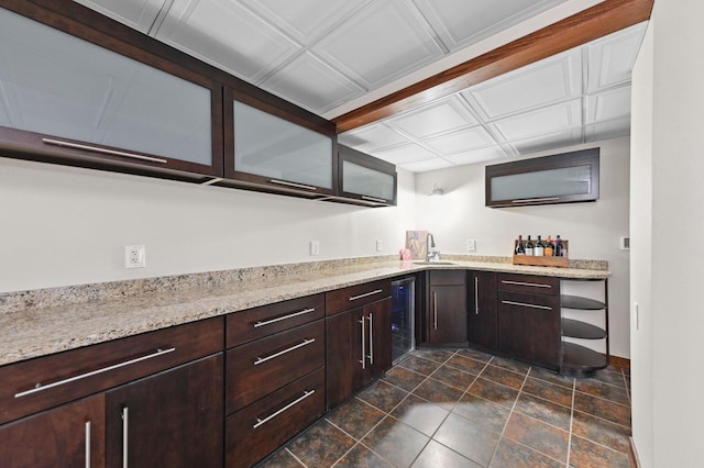 20750 Chadwick Ln, Brookfield, WI 53045 - kitchen featuring wine cooler, dark brown cabinets, open shelves, and light stone countertops