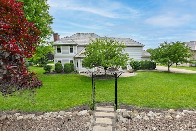 20750 Chadwick Ln, Brookfield, WI 53045 - view of front of house with a chimney and a front yard