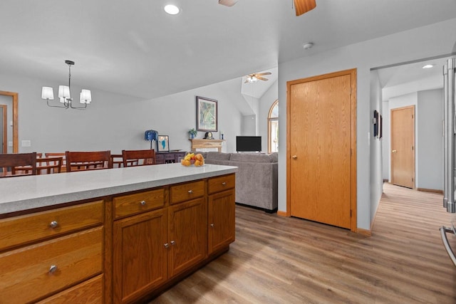 N7861 Lakeshore Dr, Fond Du Lac, WI 54937 - kitchen with ceiling fan, light wood-type flooring, light countertops, brown cabinets, and recessed lighting