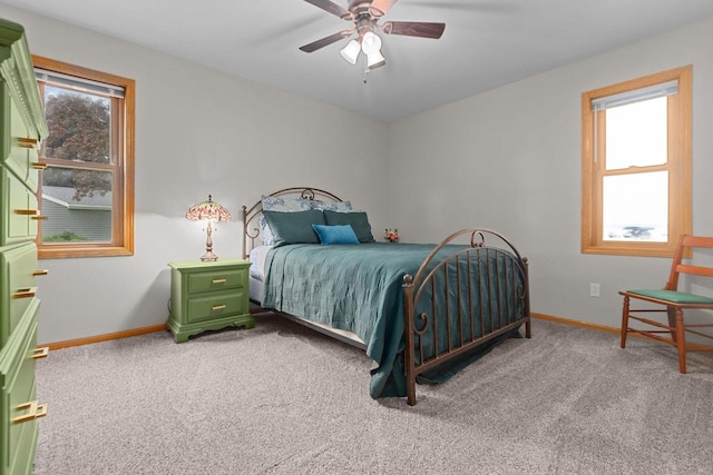 N7861 Lakeshore Dr, Fond Du Lac, WI 54937 - carpeted bedroom featuring multiple windows and ceiling fan