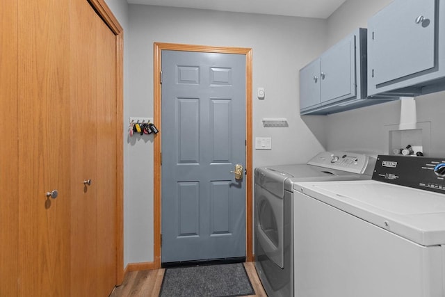 N7861 Lakeshore Dr, Fond Du Lac, WI 54937 - laundry area with cabinet space, washer and dryer, and light wood finished floors