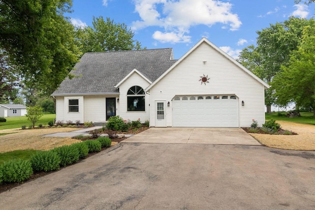 N7861 Lakeshore Dr, Fond Du Lac, WI 54937 - traditional-style house with a garage, concrete driveway, and roof with shingles