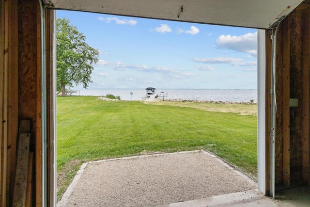 N7861 Lakeshore Dr, Fond Du Lac, WI 54937 - view of grassy yard featuring a water view and a patio area
