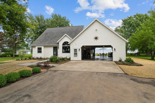 N7861 Lakeshore Dr, Fond Du Lac, WI 54937 - view of front of house featuring a garage, driveway, and a shingled roof