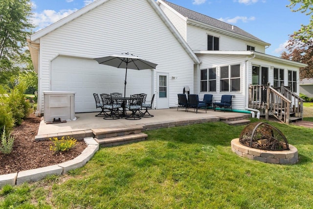N7861 Lakeshore Dr, Fond Du Lac, WI 54937 - back of property with a patio area, a yard, and a sunroom