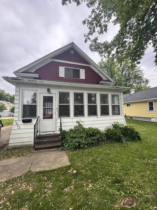 1820 Plymouth St, Oshkosh, WI 54901 - view of front of property featuring entry steps and a front lawn