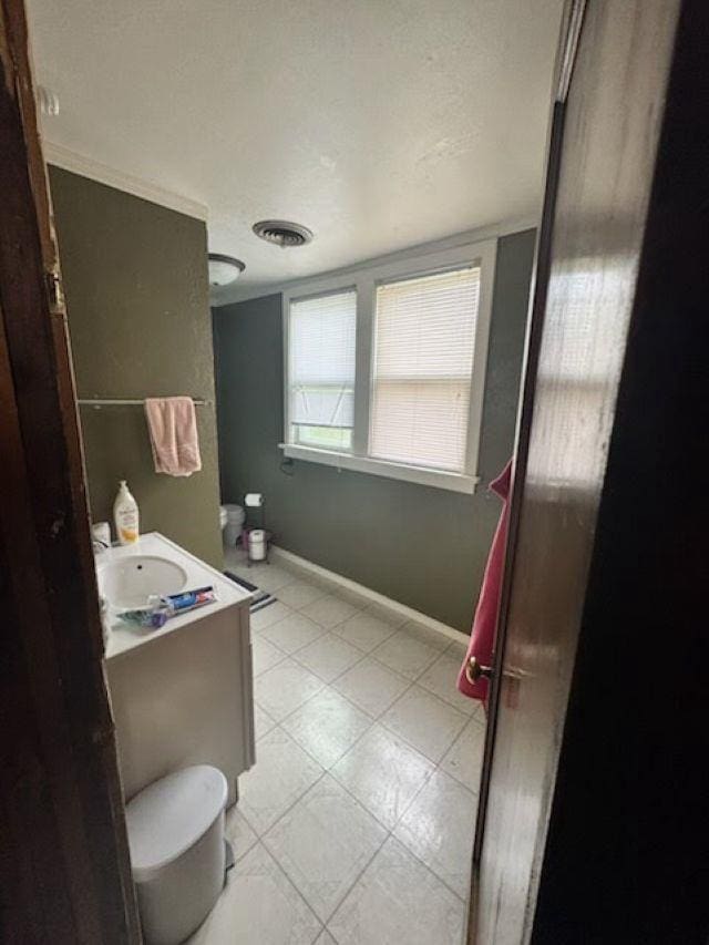 1820 Plymouth St, Oshkosh, WI 54901 - bathroom featuring vanity and tile patterned floors