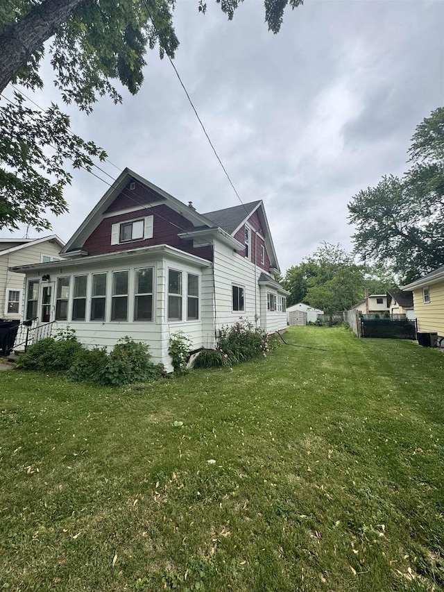 1820 Plymouth St, Oshkosh, WI 54901 - view of side of property featuring a yard