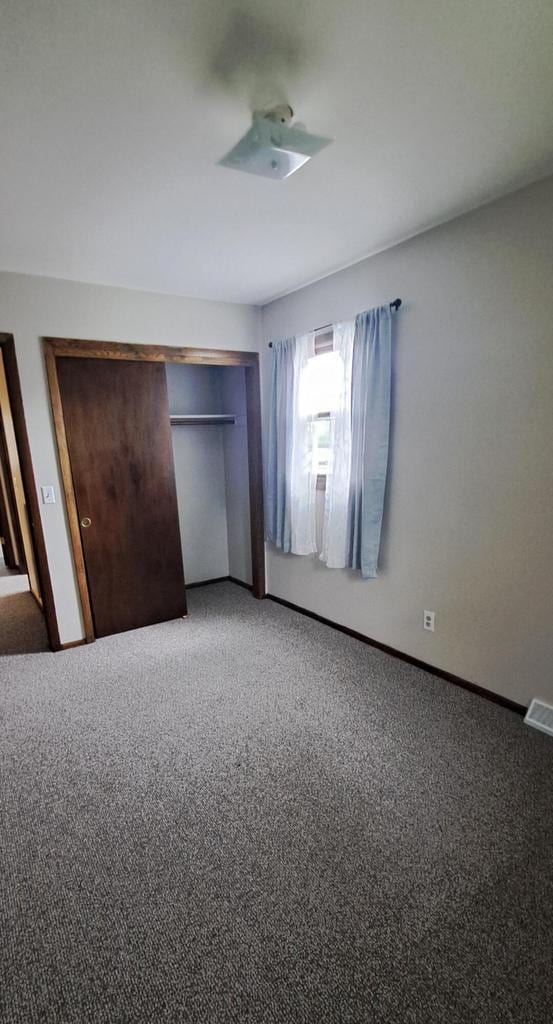 752 Imperial Ct Unit 754, West Bend, WI 53095 - unfurnished bedroom featuring light carpet