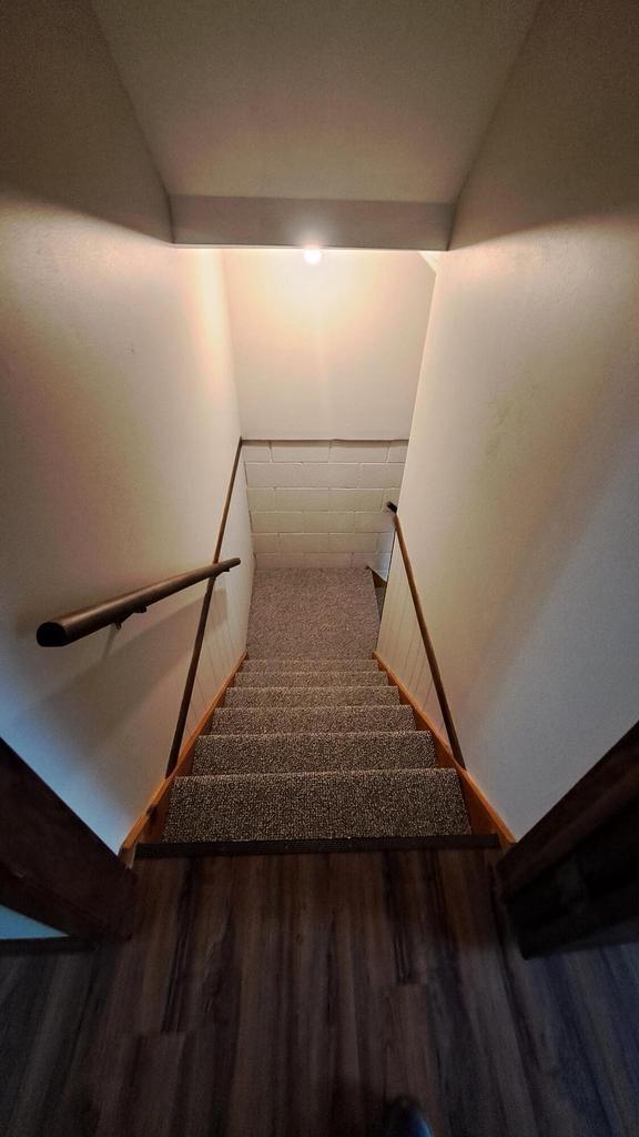 752 Imperial Ct Unit 754, West Bend, WI 53095 - stairs featuring wood finished floors