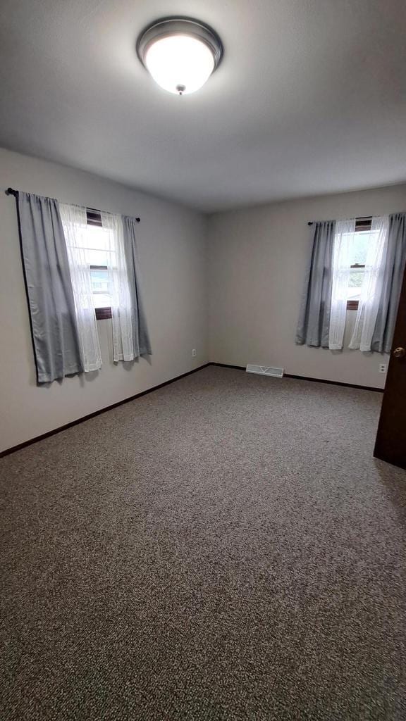 752 Imperial Ct Unit 754, West Bend, WI 53095 - carpeted empty room featuring baseboards