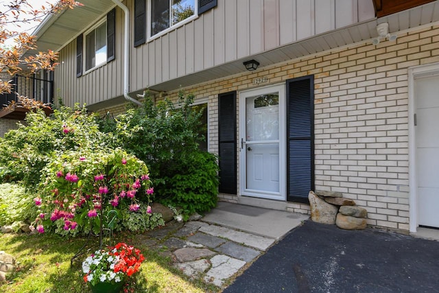 12929 N Colony Dr, Mequon, WI 53097 - entrance to property with brick siding and board and batten siding