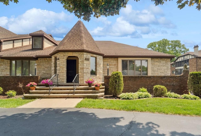 2213 Sunrise Dr, Appleton, WI 54914 - view of front facade with stone siding and roof with shingles