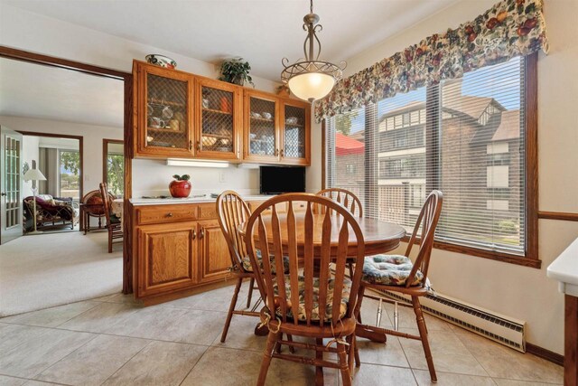 2213 Sunrise Dr, Appleton, WI 54914 - dining area featuring baseboard heating and light tile patterned flooring