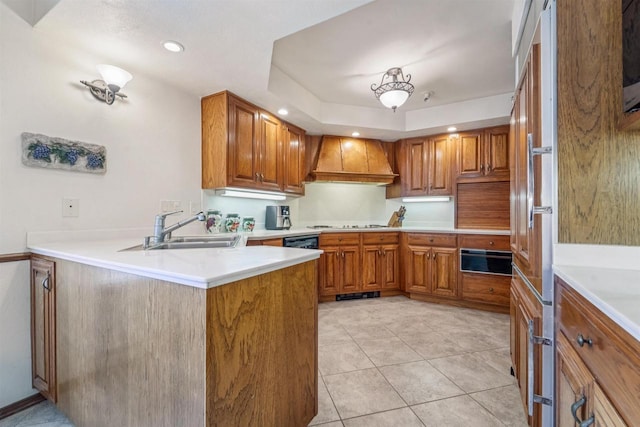 2213 Sunrise Dr, Appleton, WI 54914 - kitchen featuring premium range hood, a warming drawer, brown cabinets, a peninsula, and recessed lighting
