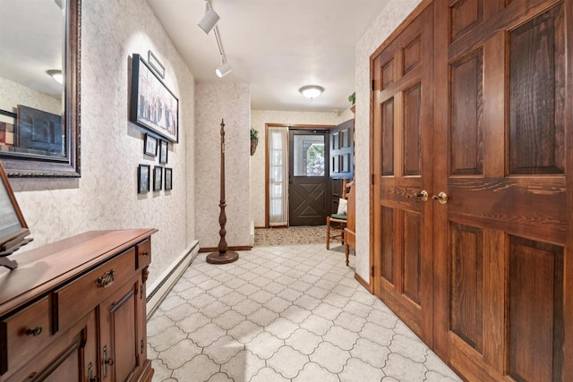 2213 Sunrise Dr, Appleton, WI 54914 - corridor with a baseboard heating unit, wallpapered walls, track lighting, and light floors