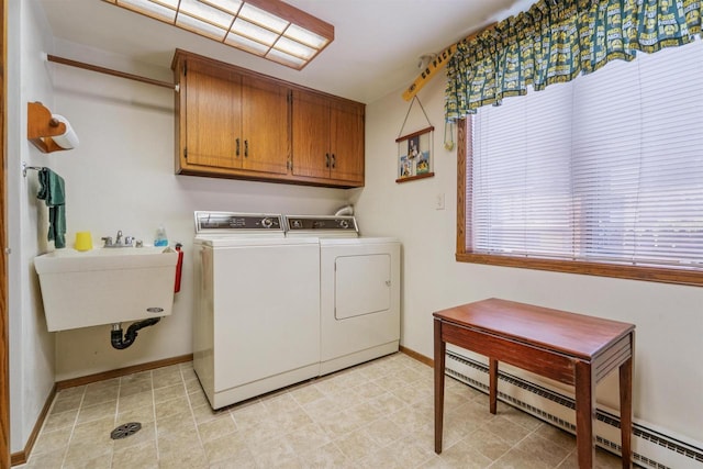 2213 Sunrise Dr, Appleton, WI 54914 - laundry room with a baseboard heating unit, cabinet space, and washing machine and dryer