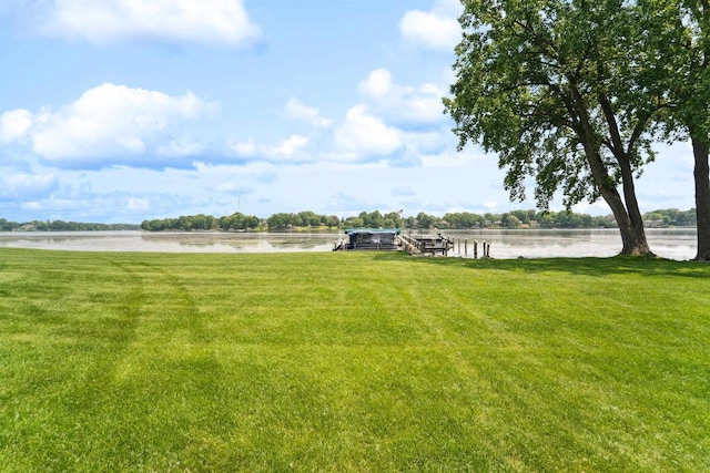 2213 Sunrise Dr, Appleton, WI 54914 - view of green lawn with a water view and a boat dock
