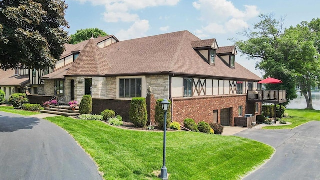 2213 Sunrise Dr, Appleton, WI 54914 - view of front of property featuring driveway, a front lawn, stone siding, and a shingled roof