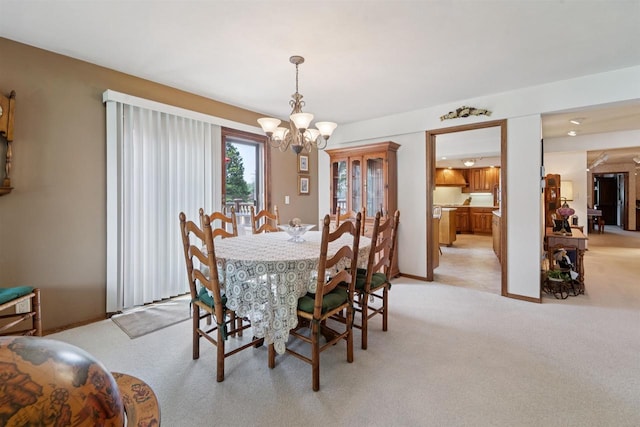 2213 Sunrise Dr, Appleton, WI 54914 - dining area with light colored carpet and a chandelier