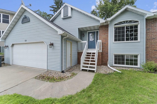 15 Naylor Cir, Madison, WI 53719 - view of front of house featuring concrete driveway, a garage, and a front lawn