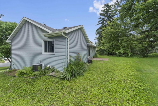 15 Naylor Cir, Madison, WI 53719 - view of side of property with a lawn and a central AC unit