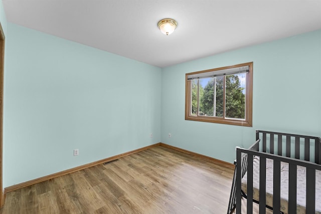 15 Naylor Cir, Madison, WI 53719 - unfurnished bedroom featuring wood finished floors