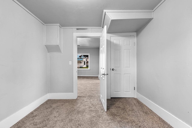 206 W Willow St, Bear Creek, WI 54922 - corridor with carpet flooring and a baseboard heating unit