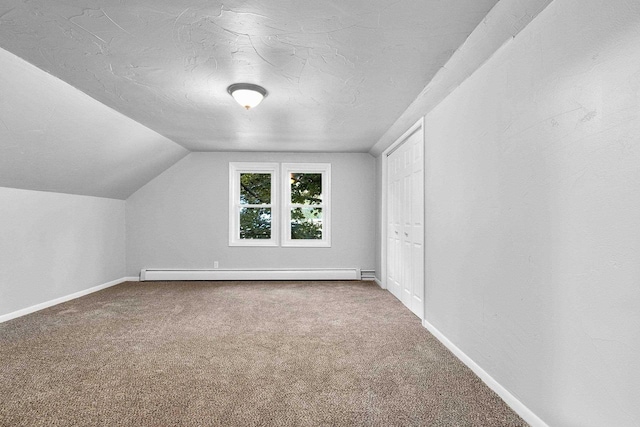 206 W Willow St, Bear Creek, WI 54922 - bonus room featuring a baseboard radiator, carpet floors, and vaulted ceiling