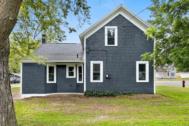 206 W Willow St, Bear Creek, WI 54922 - back of house with a lawn and a chimney