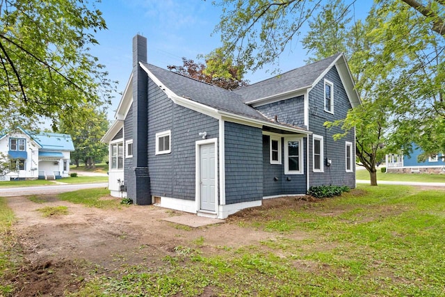 206 W Willow St, Bear Creek, WI 54922 - view of side of property featuring a chimney and roof with shingles