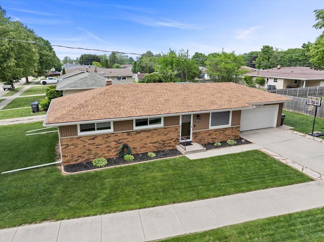 1918 Wilson Ave, Sheboygan, WI 53081 - ranch-style house featuring brick siding, a shingled roof, concrete driveway, and a garage