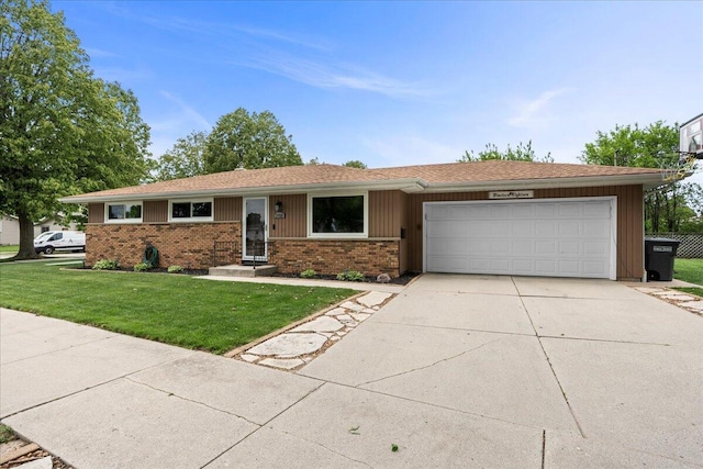 1918 Wilson Ave, Sheboygan, WI 53081 - single story home with an attached garage, brick siding, a front yard, and driveway