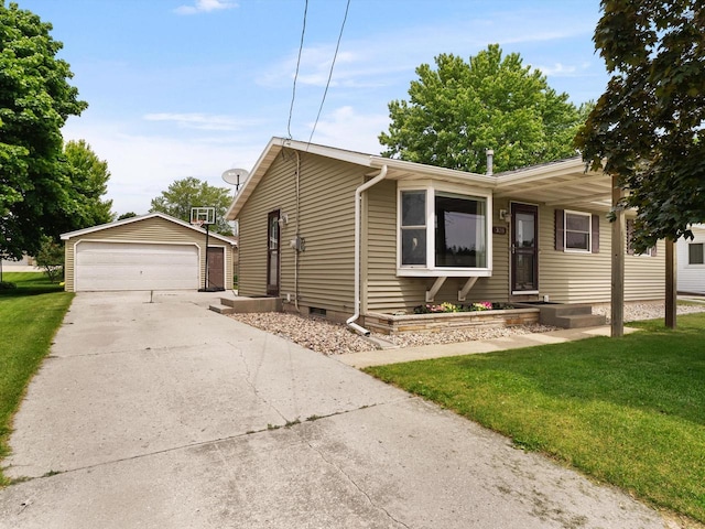 328 W Wilson St, Valders, WI 54245 - view of front facade featuring an outbuilding, a front yard, a garage, and crawl space