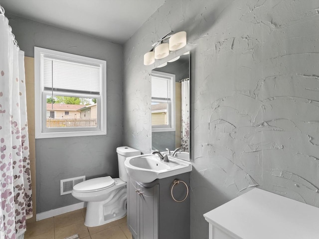 328 W Wilson St, Valders, WI 54245 - full bathroom featuring vanity, healthy amount of natural light, tile patterned floors, and a shower with curtain
