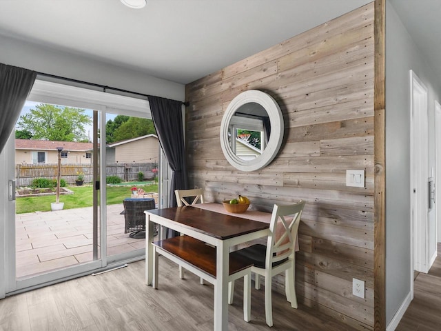 328 W Wilson St, Valders, WI 54245 - dining space with wooden walls and wood finished floors